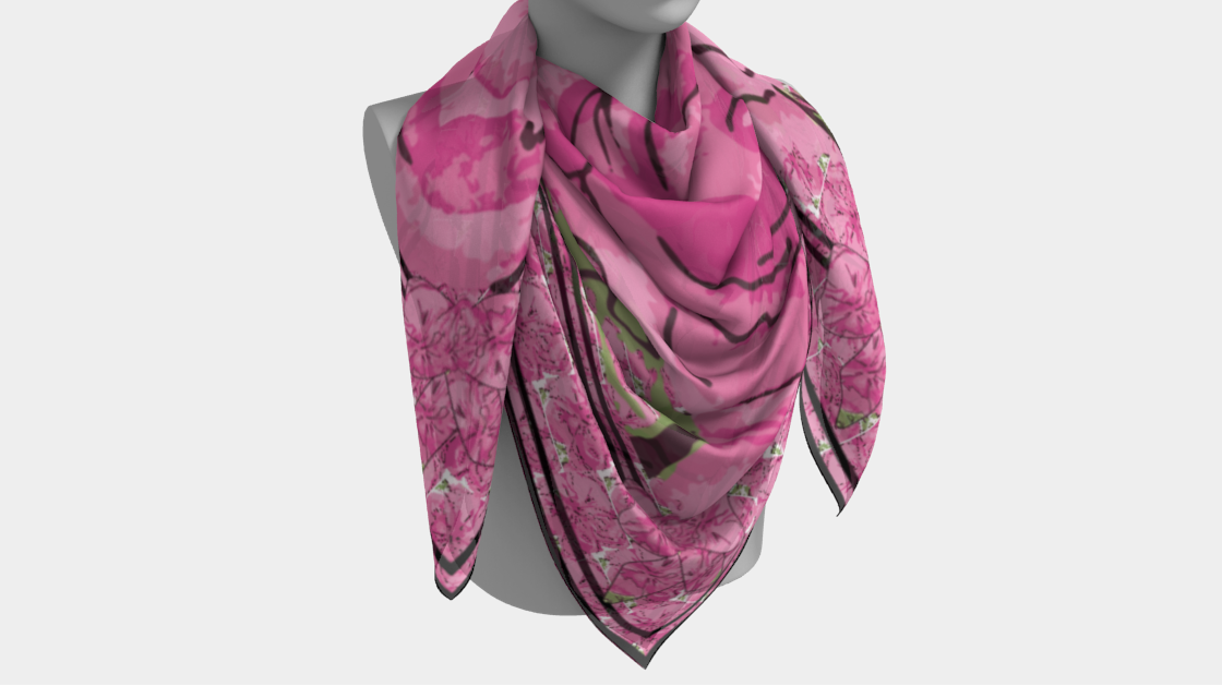 Mannequin wearing a pink patterned scarf on a white background